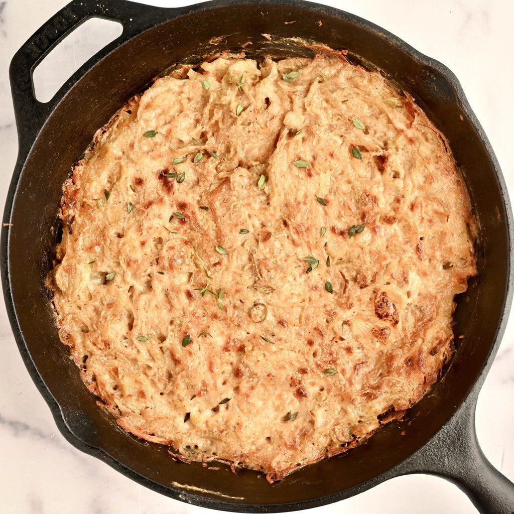 Large black skillet filled with homemade gratin