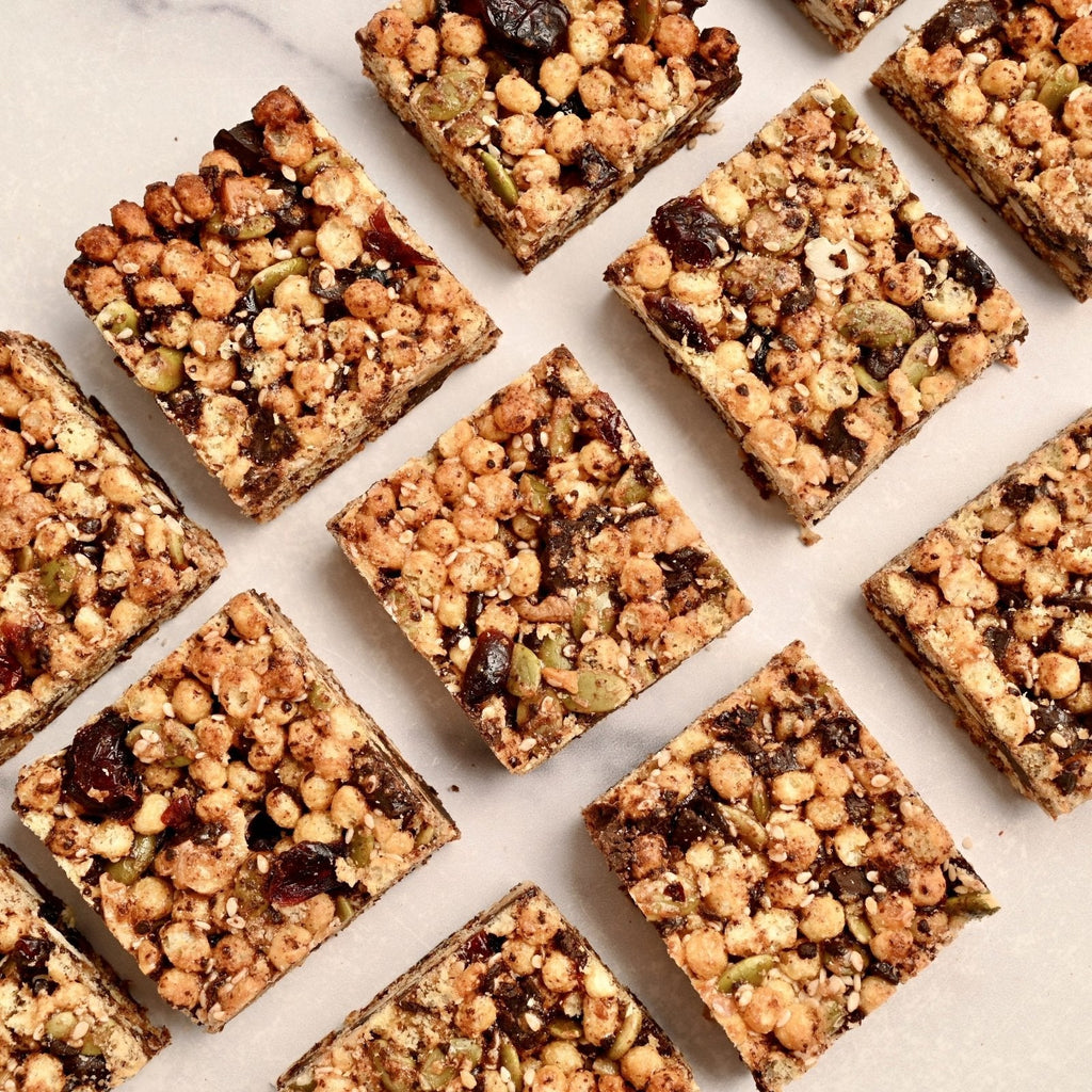A white background covered in perfectly cut homemade snack bars